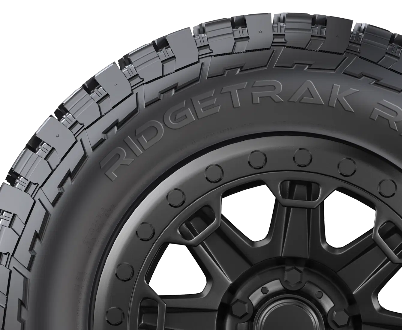 All terrain tires with rugged tread pattern, labeled 'RIDGETRAK R,' designed for off-road performance.
